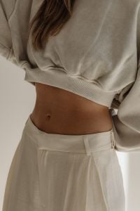 Kaboompics - Neutral Fashion Detail with Cropped Sweater and White Pants