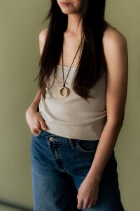 Kaboompics - Woman Wearing Long Gold Necklace and Jeans