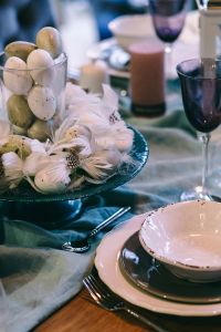 Kaboompics - Fancy restaurant dinner table decorated with quail eggs and feathers