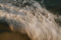 Kaboompics - Blurred Wave Foam Sandy Beach Background