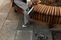 Kaboompics - Cropped Autumn Outfit with Coffee on a Curved City Bench