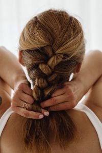 Kaboompics - French Braid Hairstyle Being Finished by Hand