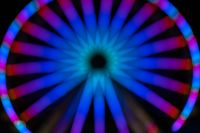 Kaboompics - Blue Ferris Wheel Bokeh with a Bright Green Center