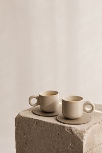 Kaboompics - Cream Coffee Cups on a Stone Plinth with Copy Space