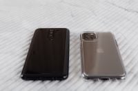Kaboompics - Side-by-Side Smartphone Backs on Bright Marble, Minimal Technology Background