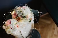 Kaboompics - Bouquet of flowers in a bag with some fairy lights