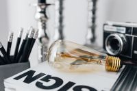 Kaboompics - Pencils, magazines and an old lightbulb