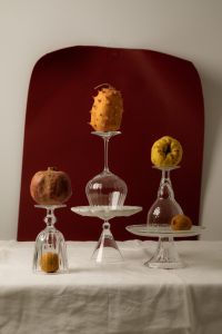 Kaboompics - Surreal Fruit Display on Inverted Glassware and Cake Stands
