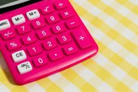 Kaboompics - Close-Up of Pink Calculator Keys on Yellow Gingham