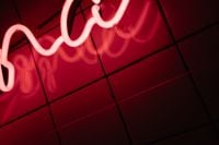 Kaboompics - Close Up of Red Neon Sign and Reflections on Tiles