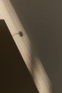 Kaboompics - Minimal Beige Wall Background with Layered Geometric Shadows