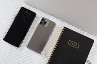 Kaboompics - Black and Silver Smartphones Beside a 2020 Planner on White Marble