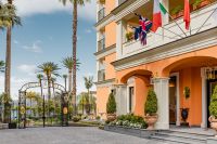 Kaboompics - Grand Hotel Royal Courtyard With Flags And Mediterranean Architecture