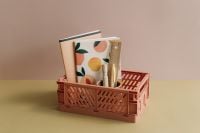 Kaboompics - Coral Basket Filled with Notebooks and Tools
