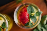 Kaboompics - Overhead Orange and Peach Summer Drink with Fresh Mint, Colorful Beverage Styling for Menus
