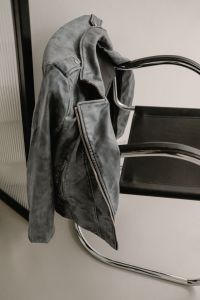 Kaboompics - Black Leather Jacket on Chrome Chair Close-Up