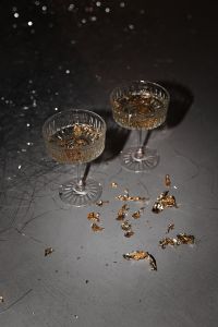 Kaboompics - Champagne Coupes With Gold Confetti And New Year's Eve Decor