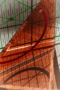 Kaboompics - Red and Green Geometric Tools and Measurement Grid