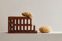 Kaboompics - Natural Sea Sponge Displayed on a Brick Stand
