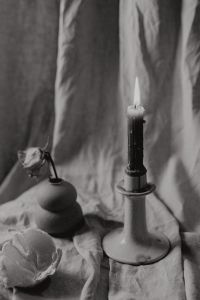 Kaboompics - Black And White Candle Still Life With Mandarin And Ceramic Holder