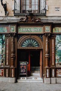 Kaboompics - Villa Rosa 17 Entrance with Ornate Tilework, Carved Stone and Iron Balconies