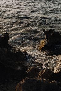 Kaboompics - Dark Rocky Inlet with Turquoise Sea Water