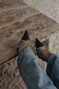 Kaboompics - Black Crystal-Strap Stilettos and Blue Jeans on Marble Steps