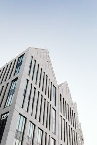 Kaboompics - Modern Gdańsk Office Architecture with Angular White Facades and Blue Glass Windows
