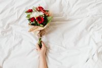 Kaboompics - Overhead Floral Bouquet on White Bedding With Copy Space