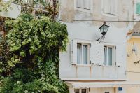 Kaboompics - White Mediterranean House with Greenery and Open Shutters