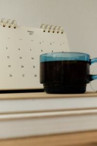 Kaboompics - January 2027 Calendar and Green Tea on Notebook Stack