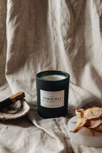 Kaboompics - Unlit Candle In Dark Glass Beside Palo Santo And Rose