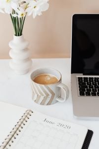 Kaboompics - Coffee, Flower Vase and Laptop in an Overhead Desk Flat Lay