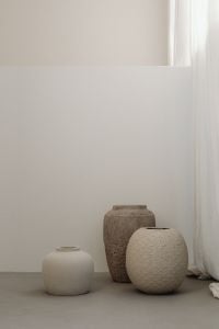 Kaboompics - Neutral Ceramic Vase Arrangement Against Light Wall and Curtain