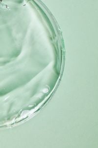 Kaboompics - Transparent Gel in Petri Dish on Green Background