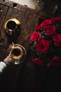 Kaboompics - Gold Coffee Cups and Red Roses on a Rustic Table, Overhead Home Coffee Still Life