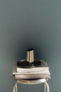 Kaboompics - Chrome Vase on Stack of Books