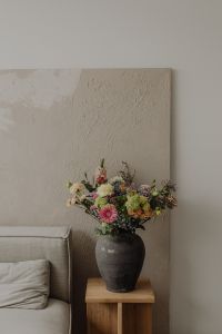 Kaboompics - Textured Plaster Wall with Floral Arrangement Below