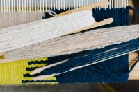 Kaboompics - Blue and Green Yarn Strands on a Loom