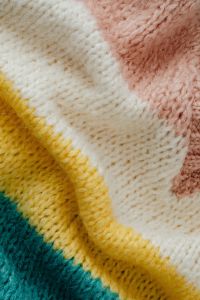 Kaboompics - Pastel Yellow Pink and Teal Sweater Texture