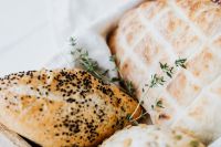 Kaboompics - Round Slovenian Bread with Sesame Seed Roll and Thyme, Artisan Food Styling