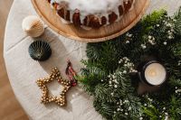 Kaboompics - Top View of Iced Bundt Cake with Christmas Candle