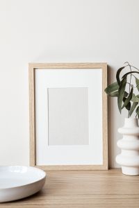 Kaboompics - Layered Wooden Picture Frame Mockup with Marble Sphere and Ceramic Vase