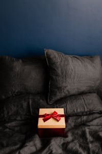 Kaboompics - Christmas Present on a Dark Bedspread