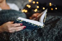 Kaboompics - Cozy Home Reading with an Open Book and Soft Gray Knitwear