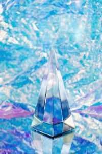 Kaboompics - Glass Prism on Blue Holographic Foil for Iridescent Product Styling
