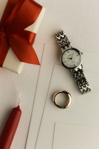 Kaboompics - Watch and Gift Box on White Paper Flat Lay