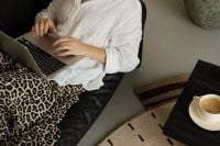 Kaboompics - Woman Working on Laptop From Black Leather Sofa