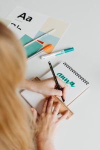 Kaboompics - Typography and Color Palette Cards with Markers on a Designer’s Desk, Vertical Flat Lay