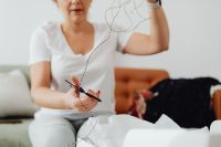 Kaboompics - Preparing String and Scissors to Finish a Small Business Shipment